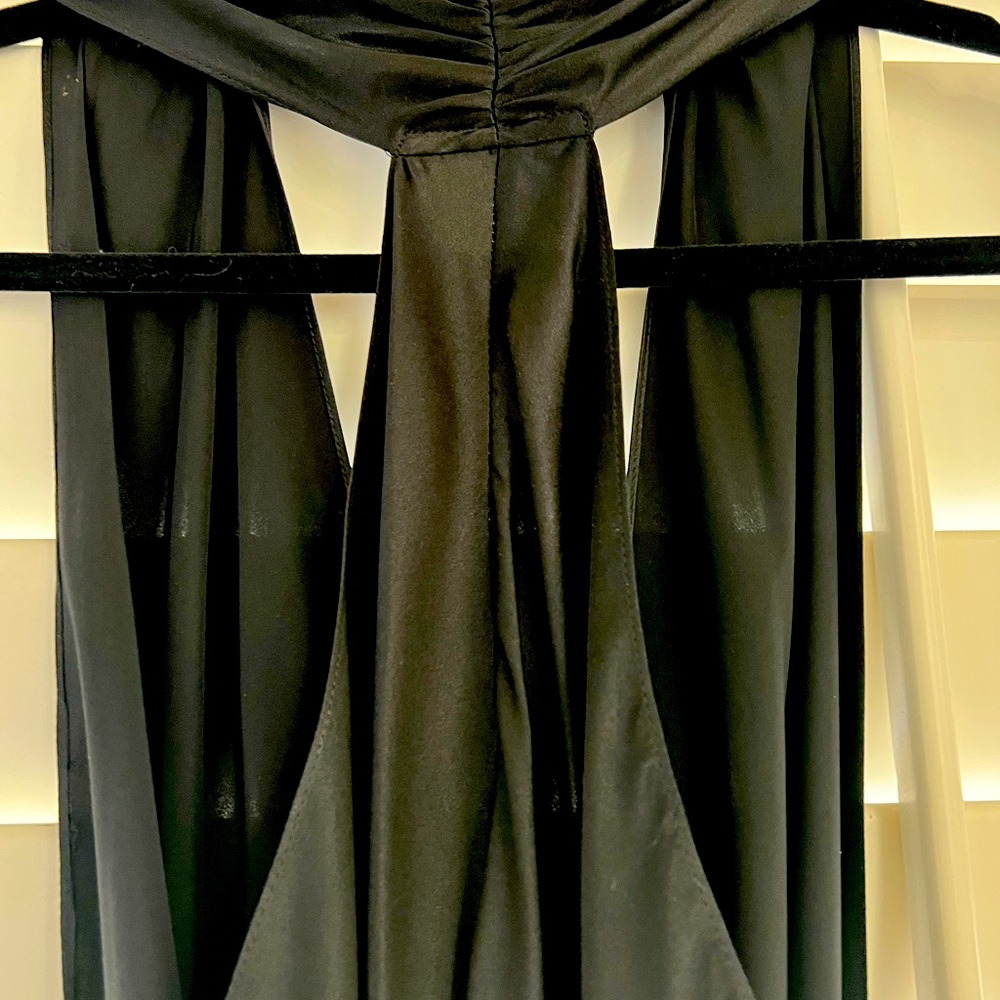 Never worn beautiful high end brand. Flattering with v neck and open back